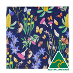 Festive fabric with colorful flowers and butterflies on a blue background, featuring 'Australian Made' logo.