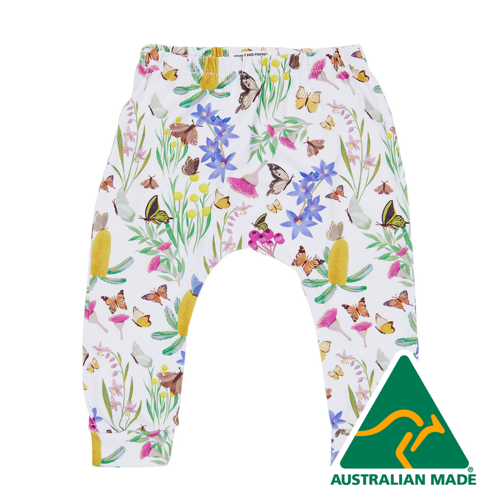 Children's pants with butterfly and floral pattern on a white background, Australian Made logo visible.