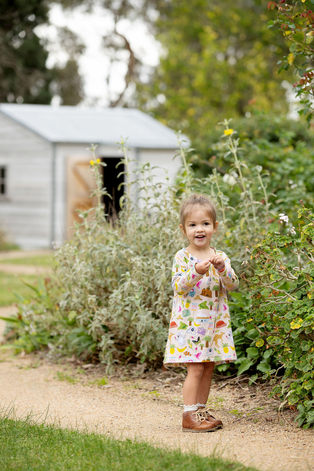 aussie-road-trip-organic-cotton-girls-dress-front-view-garden
