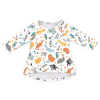 A long-sleeved girls' dress with a printed design featuring various cartoon animals and birds.