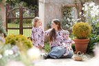 Mother and children wearing matching Backyard Birds Australian bird print clothing by Pebble and Poppet in a garden setting