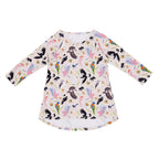 Backyard Birds organic cotton girls dress featuring colourful Australian native birds including rosellas, cockatoos, magpies and wrens with native florals on a soft blush pink background.