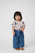 Toddler wearing Backyard Birds Australian bird print tee styled with relaxed denim pants.