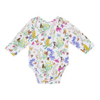Butterfly Flora organic cotton baby romper featuring butterflies, Australian wildflowers, banksias and botanical illustrations on a soft white background.
