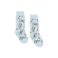 Light blue socks with cartoon character design on a white background