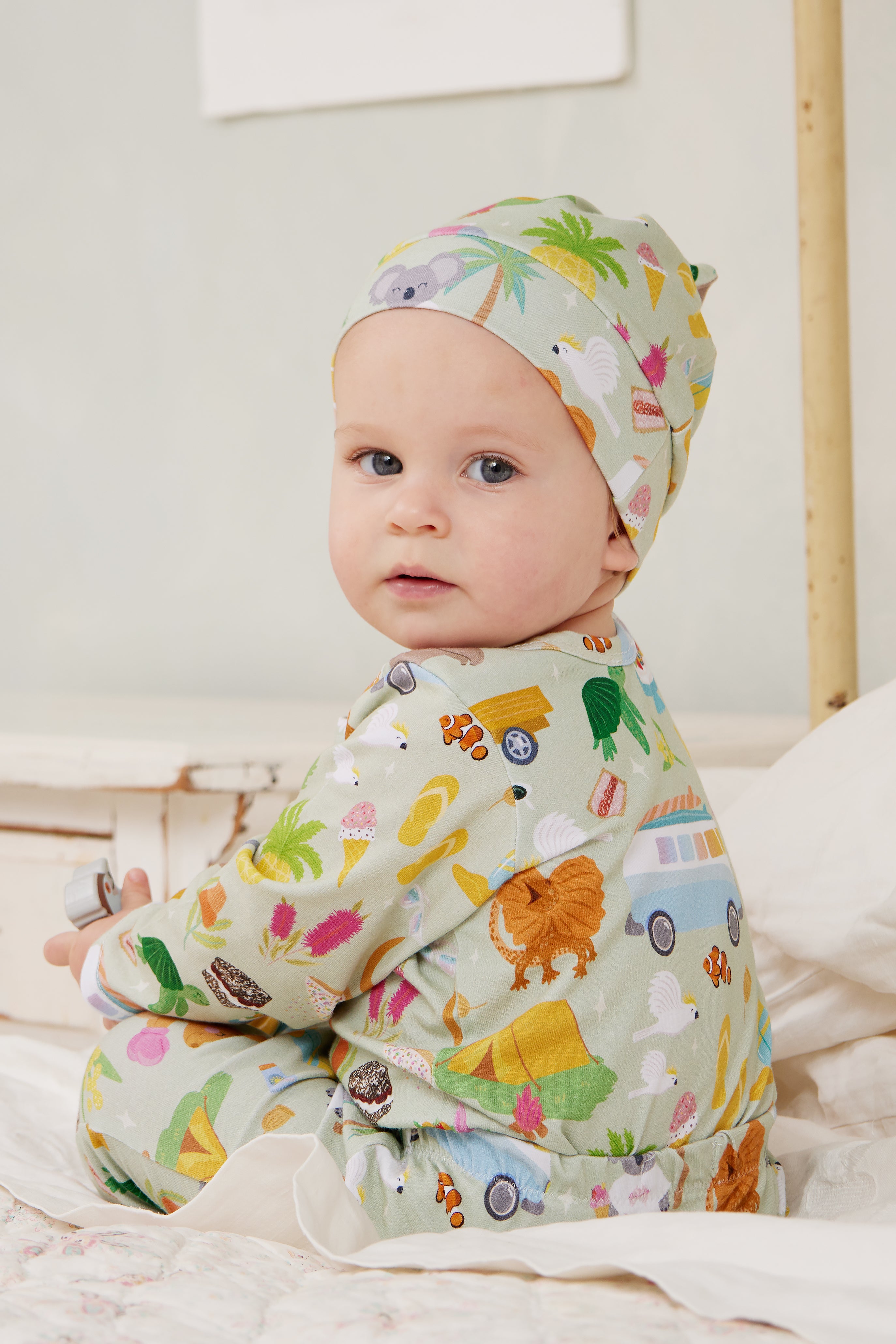 Baby wearing Summer Down Under adventure romper made from soft GOTS certified organic cotton