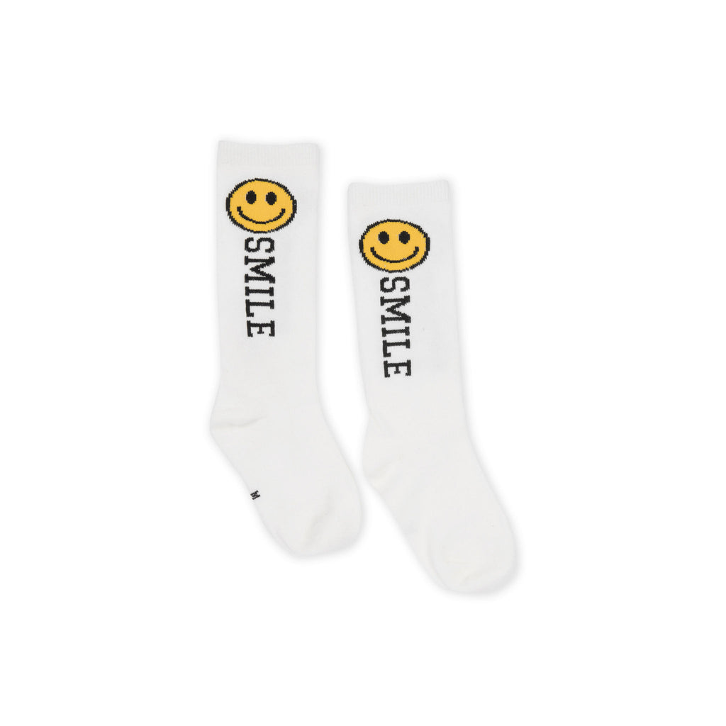 White socks with smiley face and 'smile' text on a white background